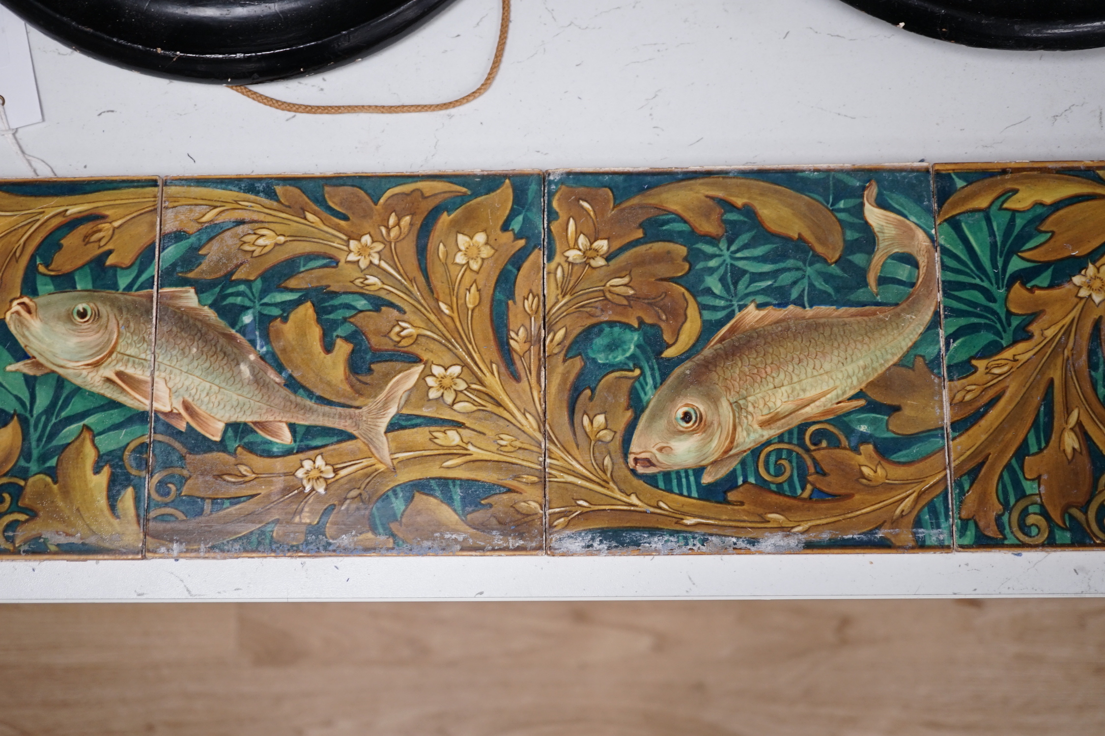 A set of six Victorian ‘fish’ decorated tiles by WB Simpson, 15cmsq